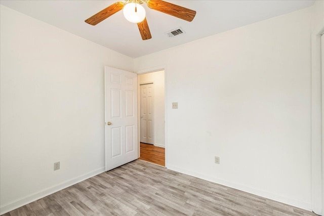 spare room with ceiling fan and light hardwood / wood-style floors