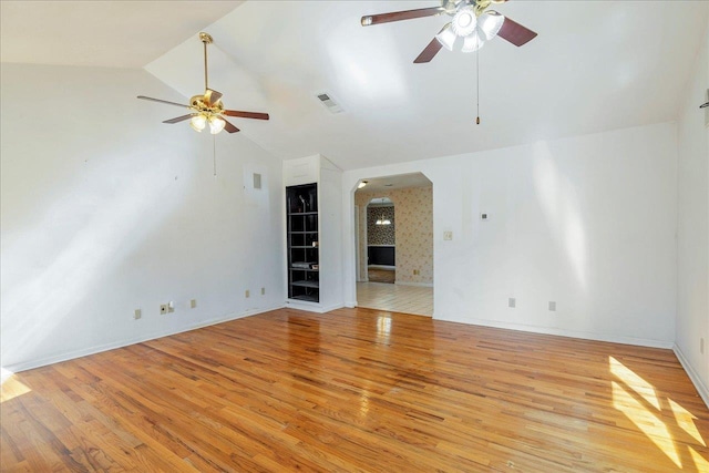 unfurnished room with high vaulted ceiling, light hardwood / wood-style flooring, and ceiling fan