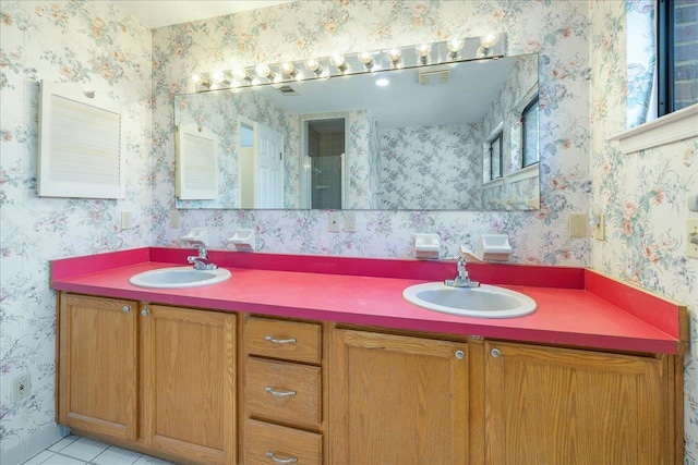 bathroom with vanity and tile patterned flooring