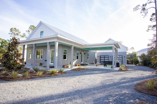 modern inspired farmhouse with metal roof and board and batten siding