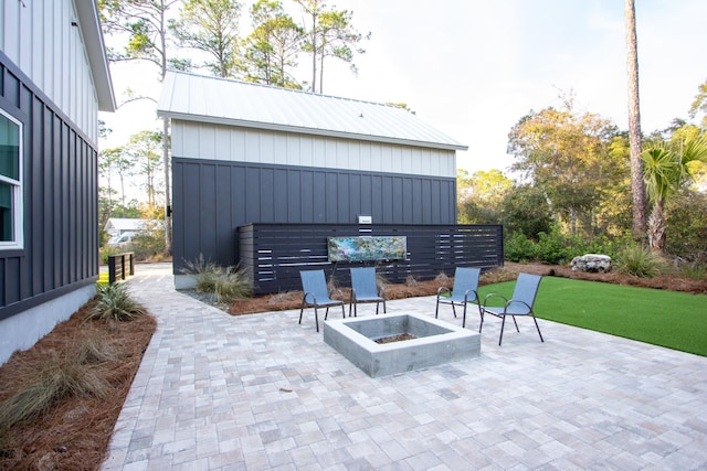 view of patio / terrace with an outdoor fire pit