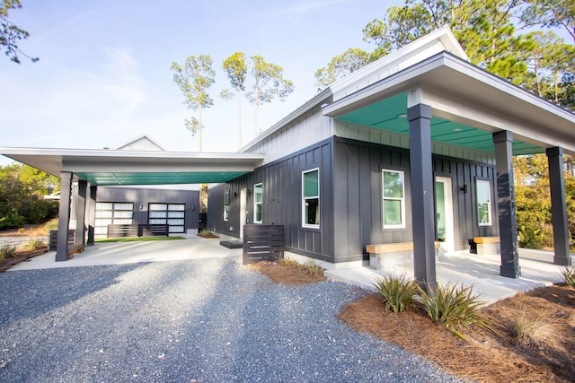 view of property exterior featuring driveway and board and batten siding