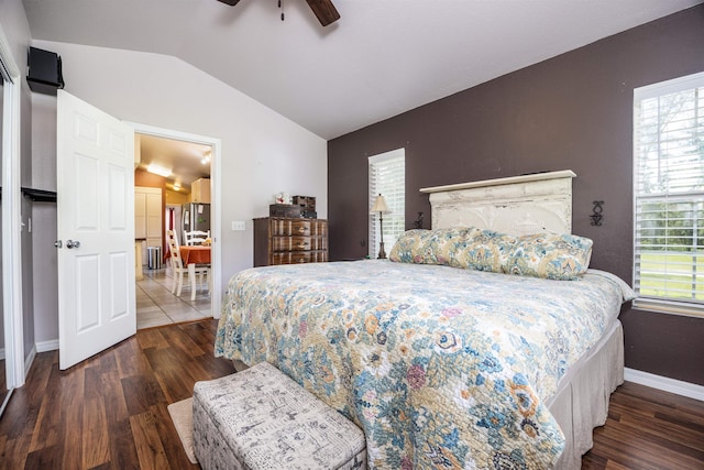 bedroom with lofted ceiling, ceiling fan, and dark hardwood / wood-style flooring