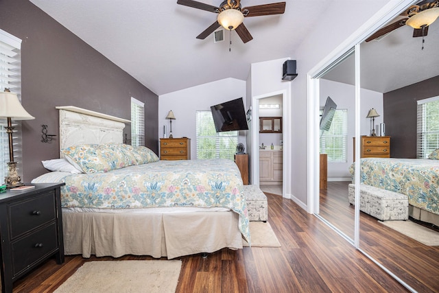 bedroom featuring a closet, multiple windows, ceiling fan, and dark hardwood / wood-style floors