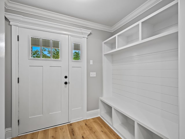 mudroom with light hardwood / wood-style floors and ornamental molding