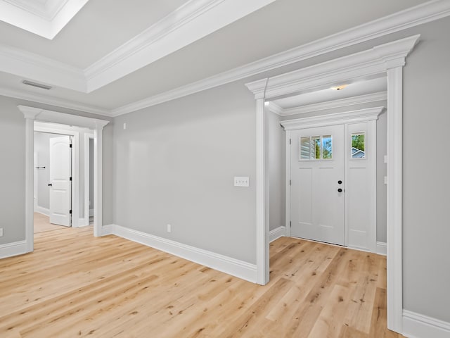 entryway with crown molding and light hardwood / wood-style flooring