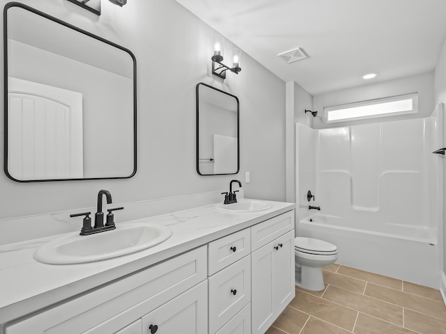 full bathroom featuring vanity, tile patterned flooring, shower / bathing tub combination, and toilet