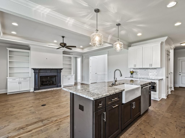 kitchen featuring ceiling fan, sink, pendant lighting, dishwasher, and white cabinetry