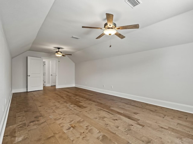 additional living space with ceiling fan, light hardwood / wood-style floors, and lofted ceiling