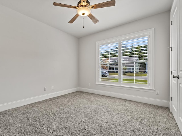 carpeted empty room with ceiling fan