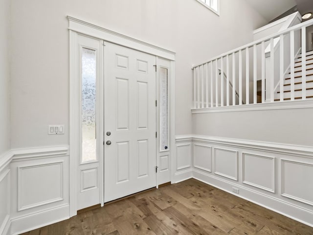 entryway with hardwood / wood-style flooring