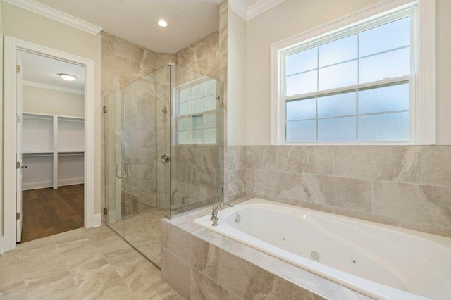 8451 Hickory Branch Trl, Tallahassee, FL 32312 - bathroom featuring crown molding, a jetted tub, a stall shower, a walk in closet, and recessed lighting