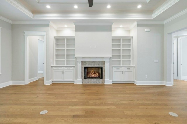 8451 Hickory Branch Trl, Tallahassee, FL 32312 - unfurnished living room featuring light wood-style flooring, a premium fireplace, crown molding, built in features, and recessed lighting