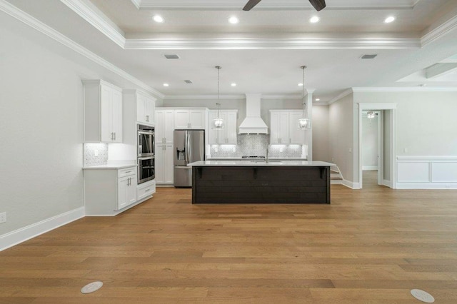 8451 Hickory Branch Trl, Tallahassee, FL 32312 - kitchen with appliances with stainless steel finishes, premium range hood, backsplash, light countertops, and recessed lighting