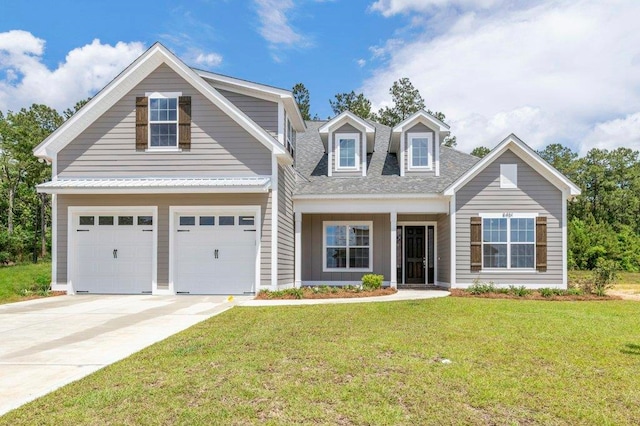 8451 Hickory Branch Trl, Tallahassee, FL 32312 - view of front of house with a front yard, driveway, an attached garage, and roof with shingles