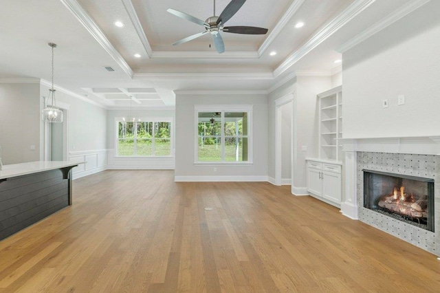 8451 Hickory Branch Trl, Tallahassee, FL 32312 - unfurnished living room with a ceiling fan, a fireplace, light wood-type flooring, crown molding, and built in features
