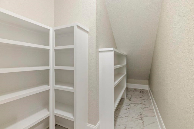8451 Hickory Branch Trl, Tallahassee, FL 32312 - walk in closet featuring marble look tile flooring