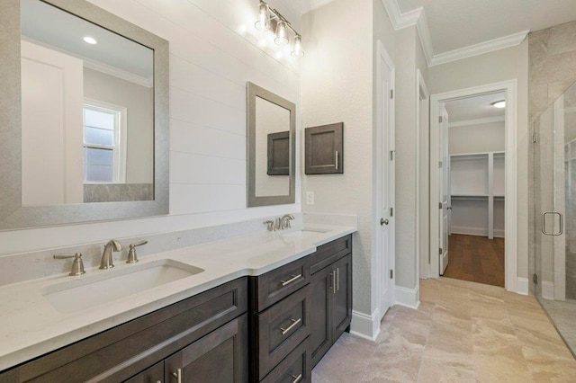 8451 Hickory Branch Trl, Tallahassee, FL 32312 - bathroom with crown molding, a shower stall, double vanity, and a spacious closet