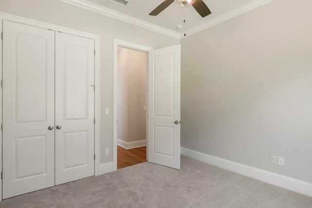 8451 Hickory Branch Trl, Tallahassee, FL 32312 - unfurnished bedroom featuring carpet, a closet, crown molding, and ceiling fan