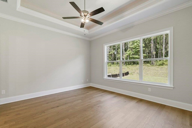 8451 Hickory Branch Trl, Tallahassee, FL 32312 - empty room with a tray ceiling, ornamental molding, wood finished floors, and ceiling fan