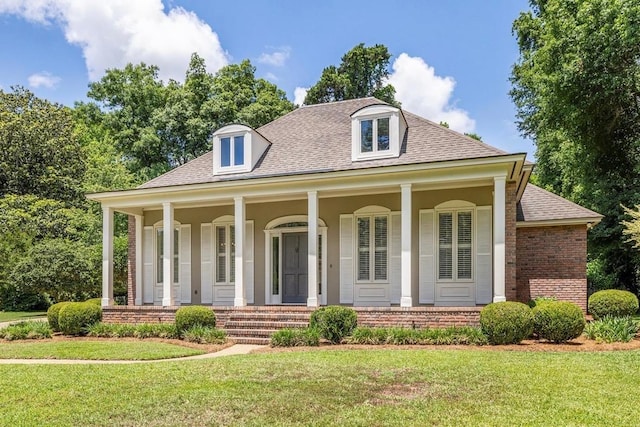 1370 Millstream Rd, Tallahassee, FL 32312 - view of front of house featuring a shingled roof, brick siding, and a front lawn