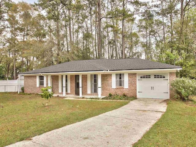 ranch-style house with a garage and a front lawn