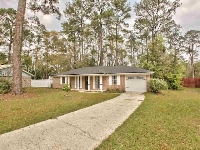 single story home with a garage and a front yard