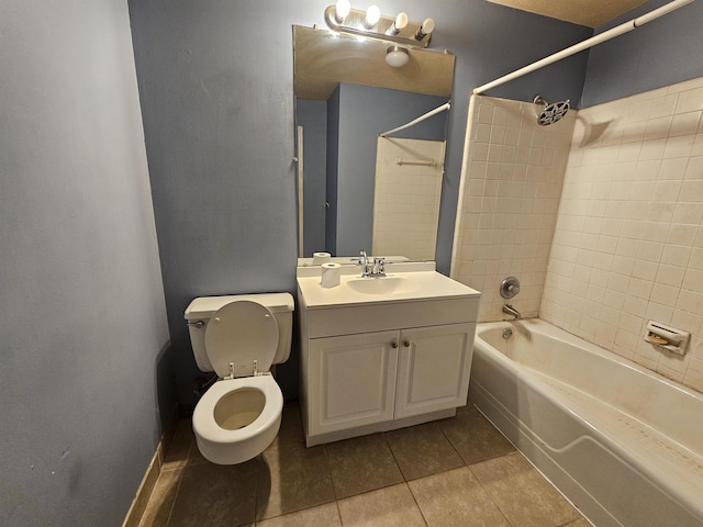 full bathroom featuring toilet, tile patterned flooring, tiled shower / bath combo, and vanity