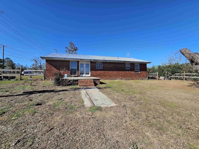 back of property featuring french doors