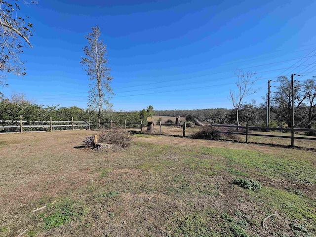 view of yard with a rural view