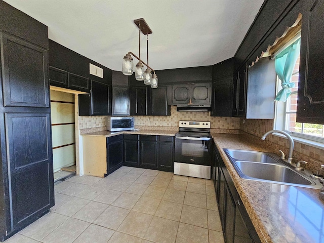 kitchen with pendant lighting, stainless steel appliances, sink, ventilation hood, and light tile patterned floors