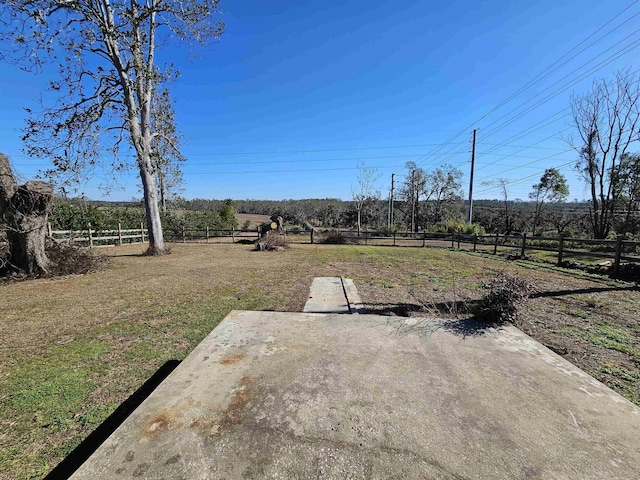 view of yard with a rural view