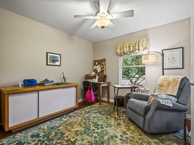 living area featuring ceiling fan and wood-type flooring