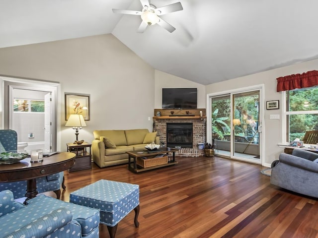 living room featuring ceiling fan, dark wood-type flooring, and vaulted ceiling