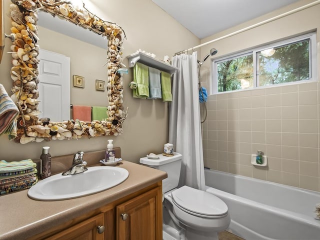 full bathroom with toilet, vanity, and shower / tub combo with curtain