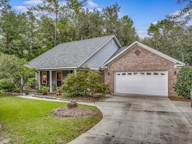 view of front of property with a front yard and a garage