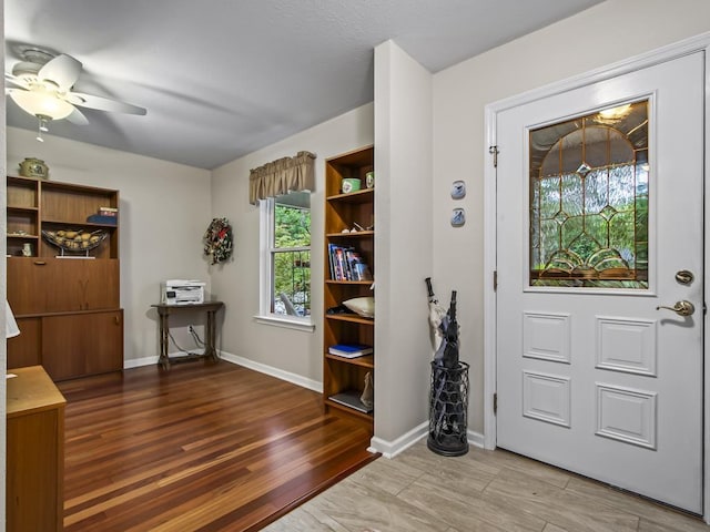 entryway with hardwood / wood-style floors and ceiling fan