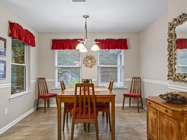 dining area featuring a chandelier and a healthy amount of sunlight