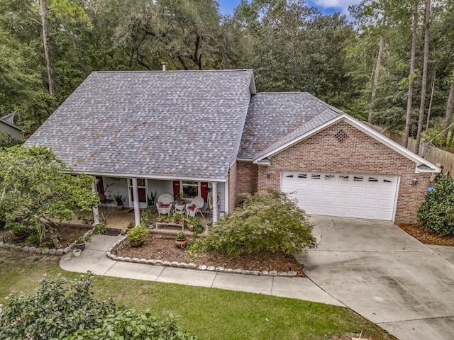 view of front of home featuring a garage and covered porch