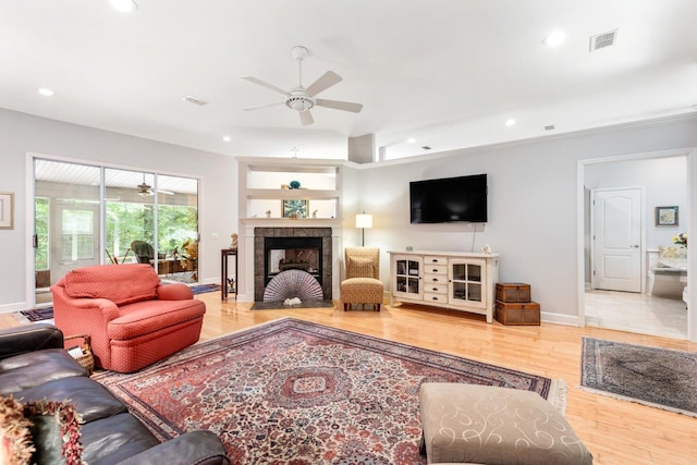 3540 Trillium Ct, Tallahassee, FL 32312 - living area featuring ceiling fan, wood finished floors, recessed lighting, and a tile fireplace