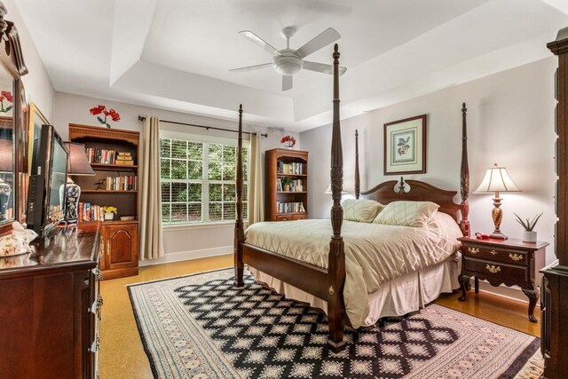 3540 Trillium Ct, Tallahassee, FL 32312 - bedroom featuring a raised ceiling and a ceiling fan