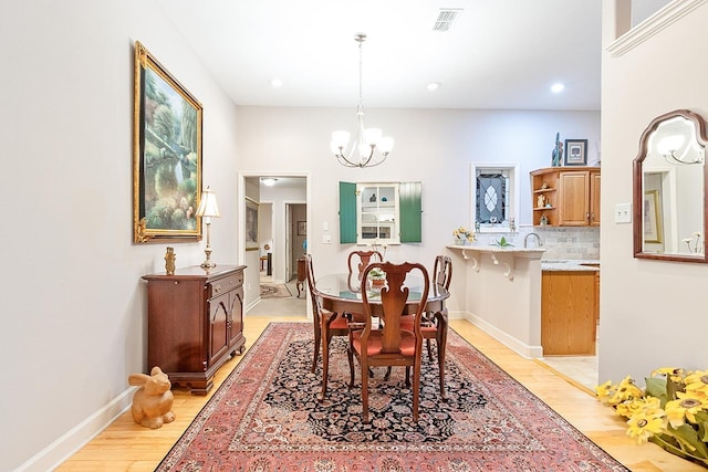 3540 Trillium Ct, Tallahassee, FL 32312 - dining space with a chandelier, light wood-style flooring, and recessed lighting