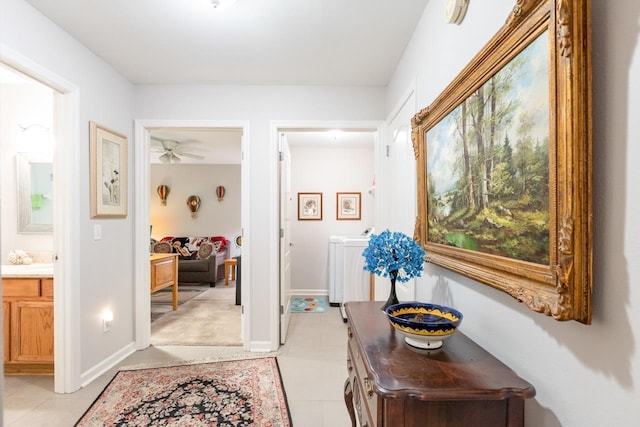 3540 Trillium Ct, Tallahassee, FL 32312 - hall featuring independent washer and dryer and light tile patterned floors