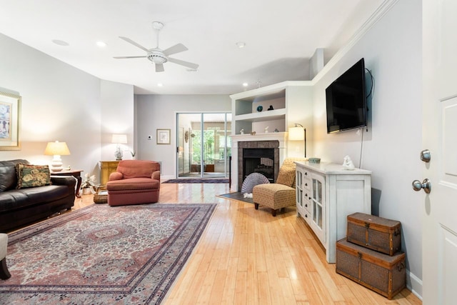 3540 Trillium Ct, Tallahassee, FL 32312 - living area featuring a ceiling fan, a tiled fireplace, light wood-style floors, and recessed lighting