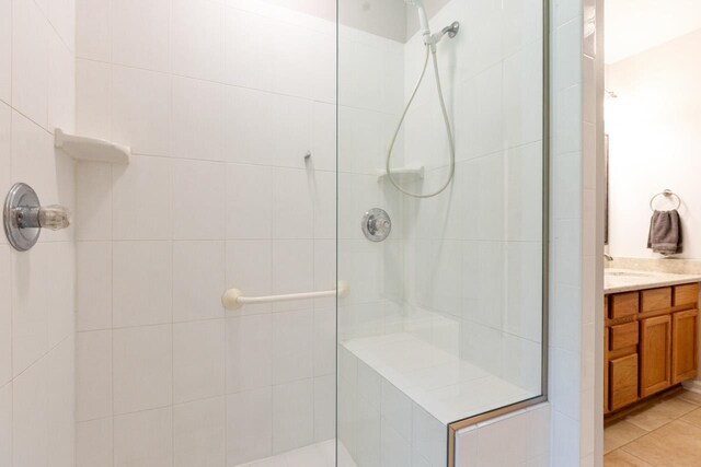 3540 Trillium Ct, Tallahassee, FL 32312 - full bathroom featuring a tile shower, vanity, and tile patterned flooring