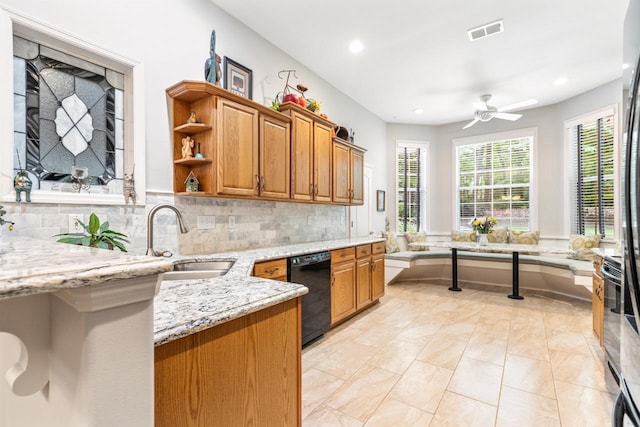 3540 Trillium Ct, Tallahassee, FL 32312 - kitchen featuring dishwasher, ceiling fan, brown cabinetry, tasteful backsplash, and recessed lighting