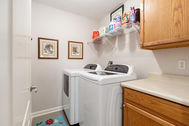 3540 Trillium Ct, Tallahassee, FL 32312 - washroom with cabinet space and washer and clothes dryer