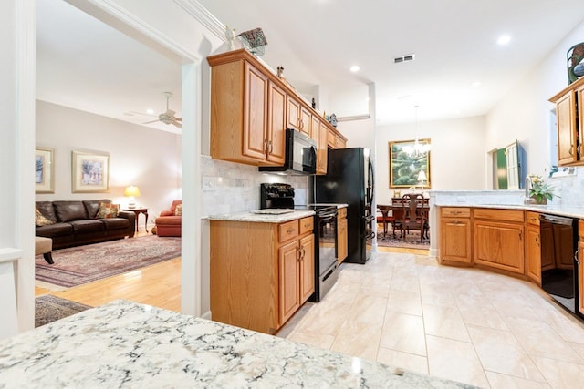 3540 Trillium Ct, Tallahassee, FL 32312 - kitchen with black appliances, decorative backsplash, a ceiling fan, recessed lighting, and light stone countertops