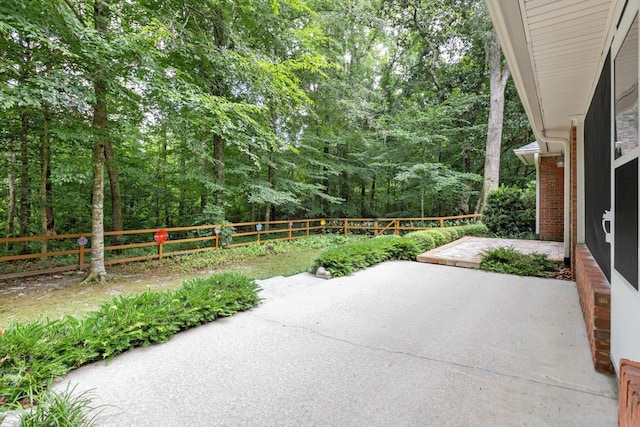 3540 Trillium Ct, Tallahassee, FL 32312 - fenced backyard featuring a patio and a wooded view