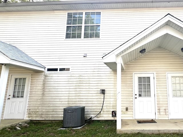 doorway to property with central air condition unit